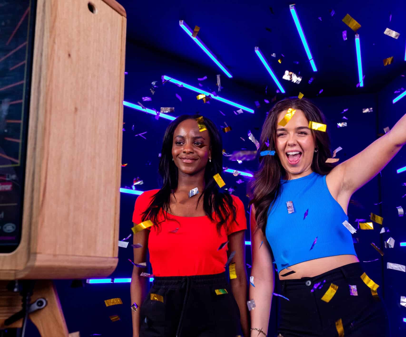 A couple posing for a photo booth with a sleek, minimalist setup and professional lighting, giving off a high-fashion "Vogue" magazine feel.