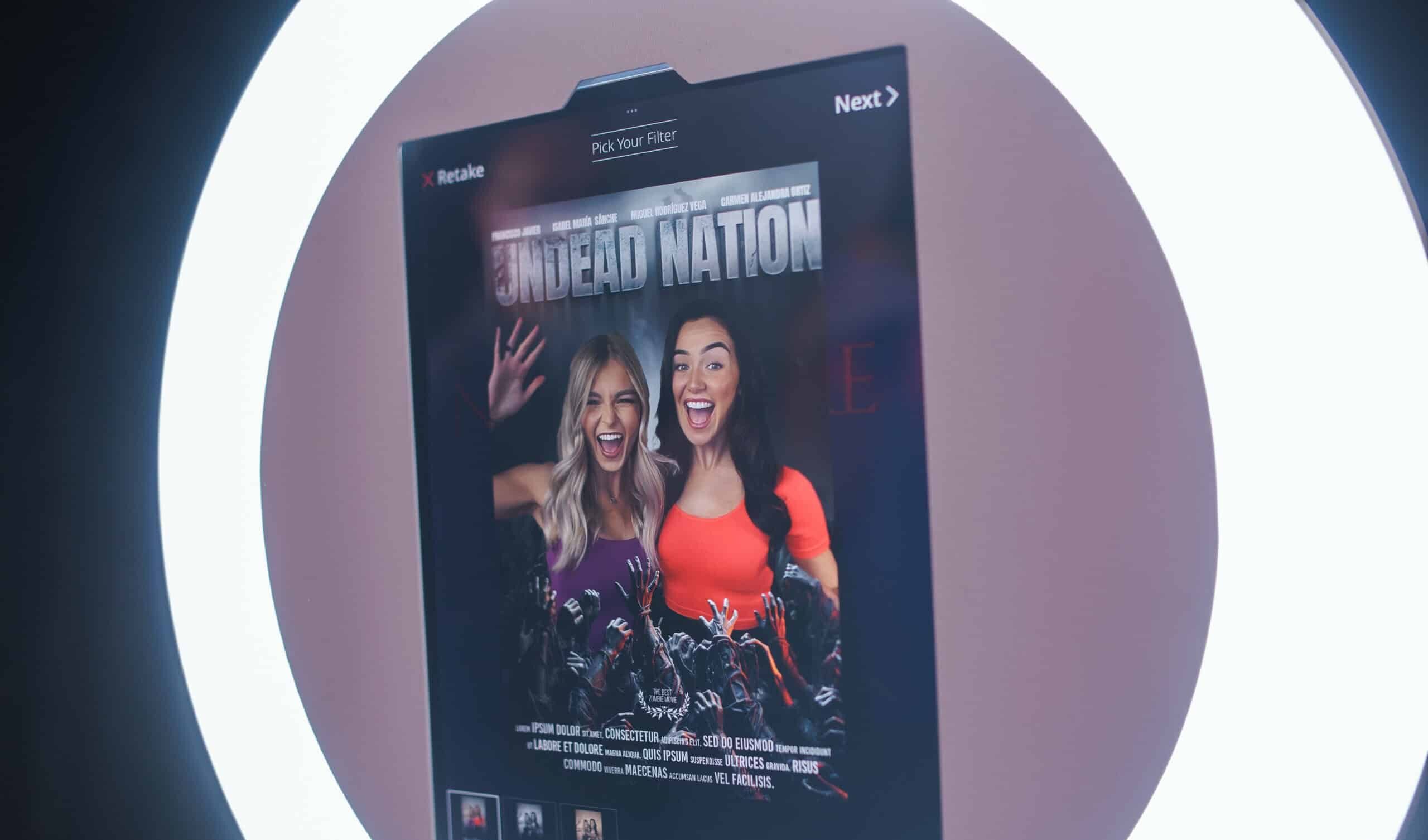 Guests posing at a corporate party photo booth