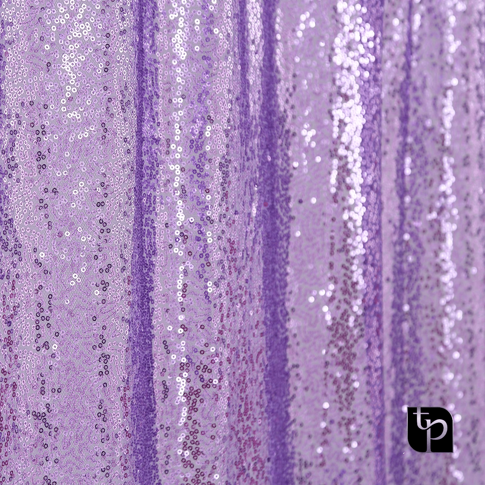 Purple sequin backdrop from The Phototique, showcasing shimmering texture and vibrant color for enhancing photography settings.