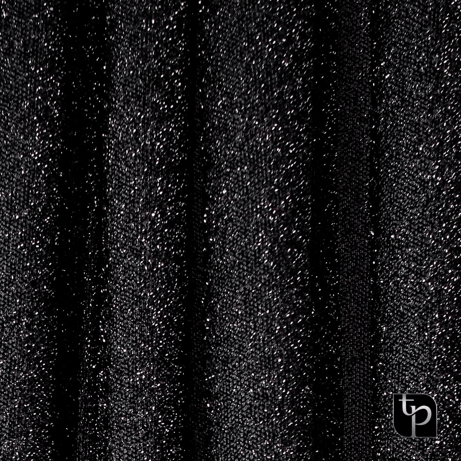 Black glitter backdrop fabric with shimmering texture, ideal for enhancing photography settings, featuring The Phototique logo.