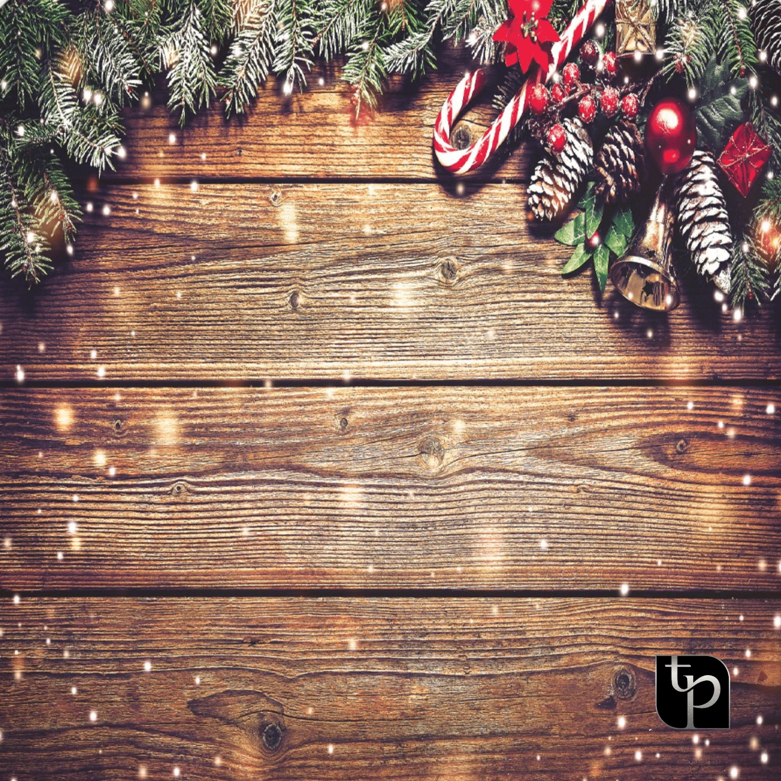 Christmas-themed backdrop featuring pine branches, ornaments, candy canes, and snowflakes on a wooden surface, ideal for holiday photo shoots by The Phototique.