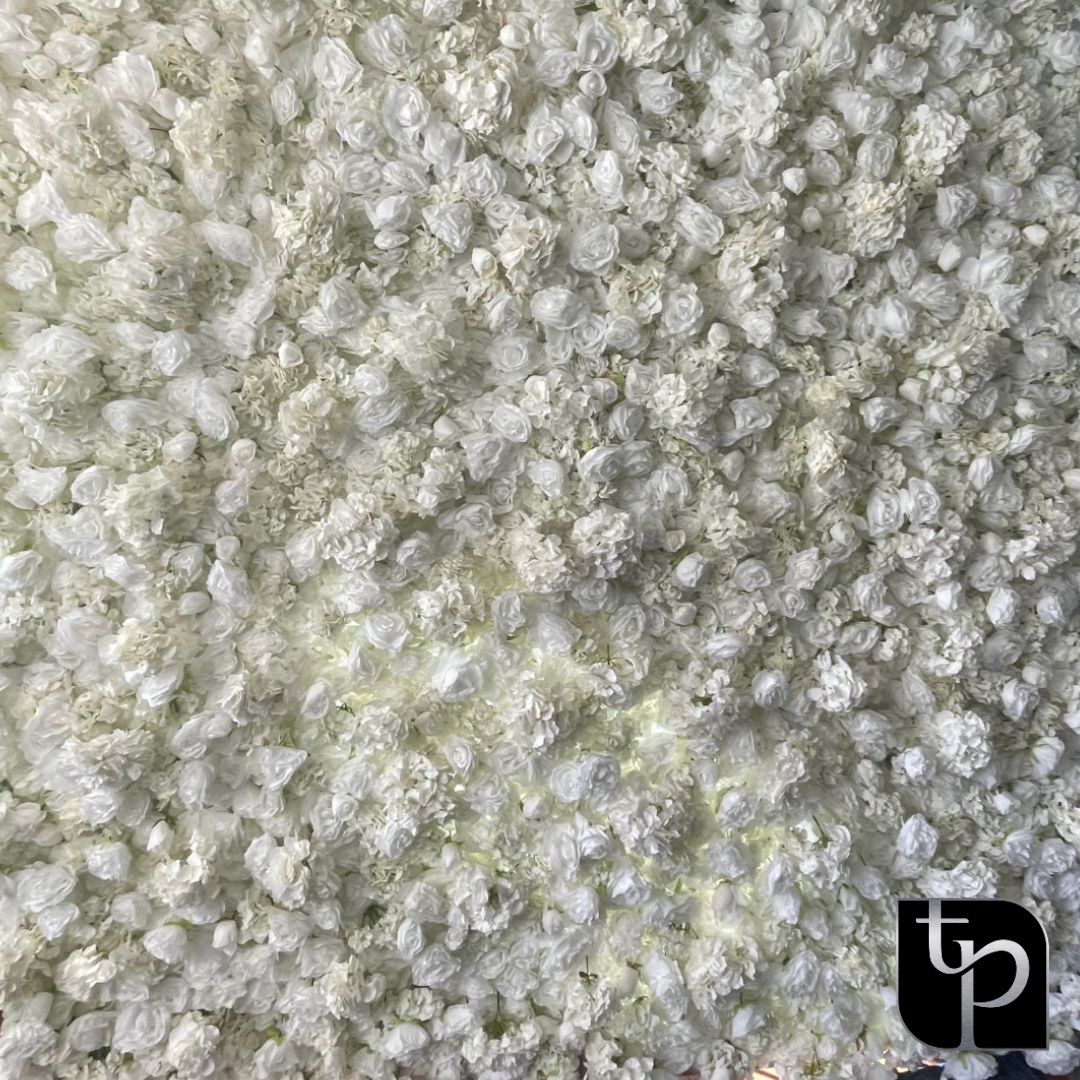 White floral backdrop featuring intricate flower designs, ideal for enhancing photography settings, with The Phototique logo in the bottom corner.