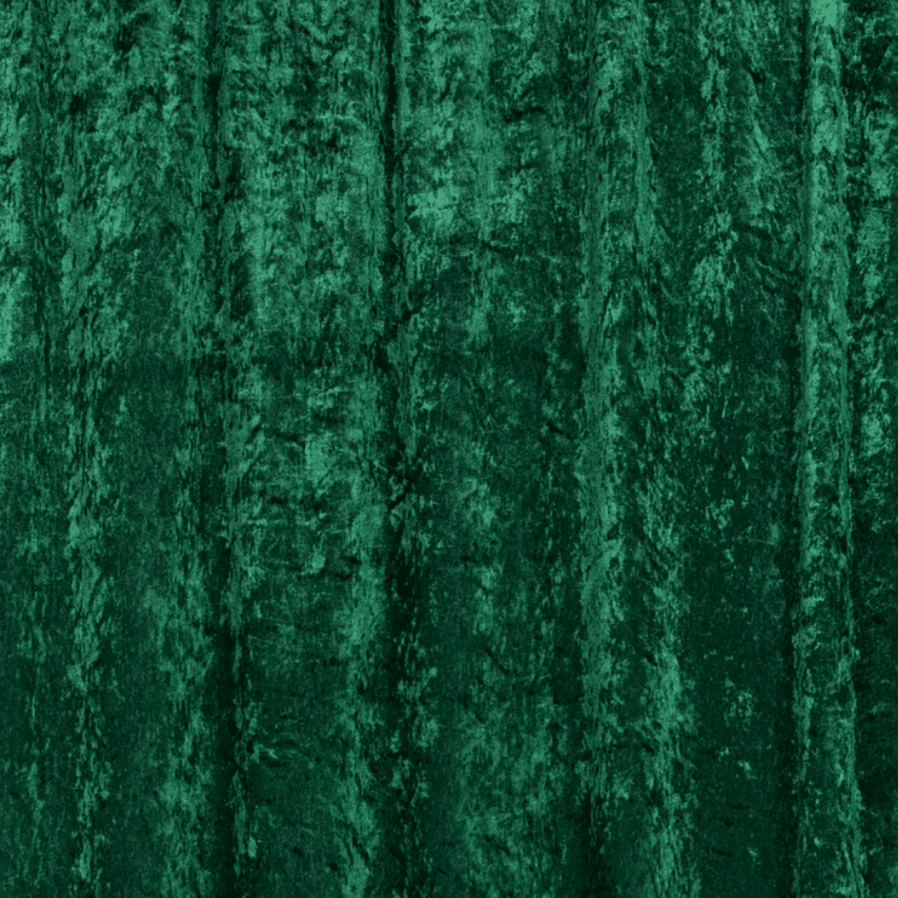 Green velvet backdrop with textured folds, ideal for enhancing photography settings.