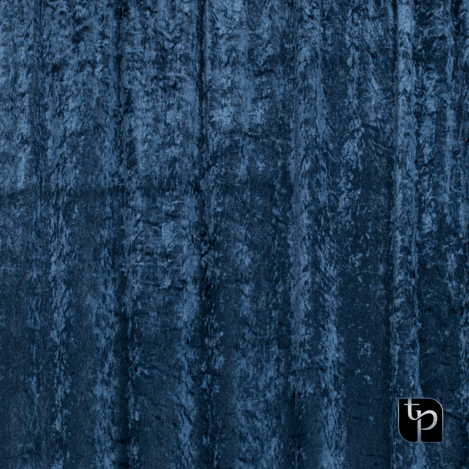 Dark blue velvet backdrop with textured surface, featuring The Phototique logo in the bottom right corner, ideal for enhancing photography settings.