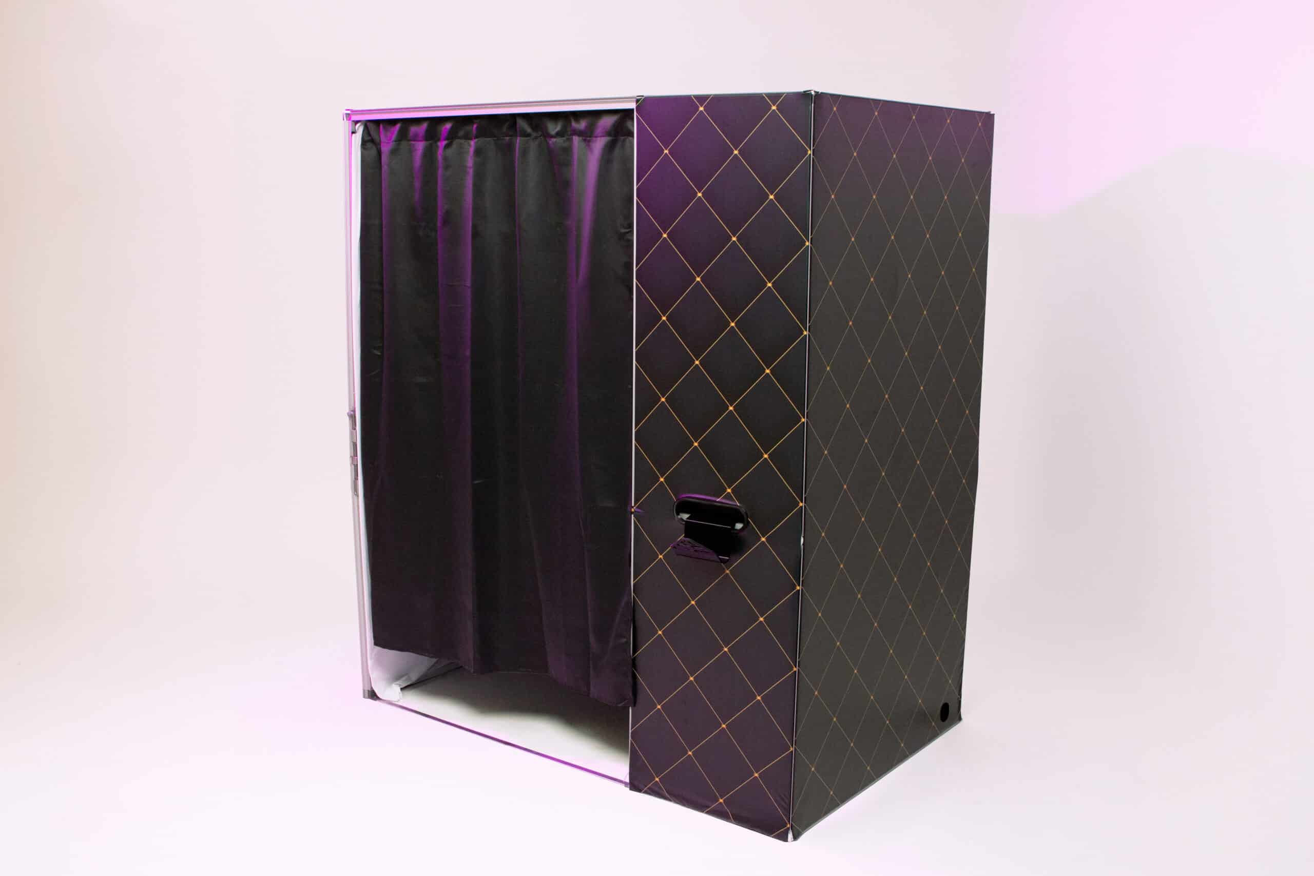 Private enclosed photo booth with modern design, featuring a sleek exterior and black curtains, ideal for events like weddings and corporate parties.