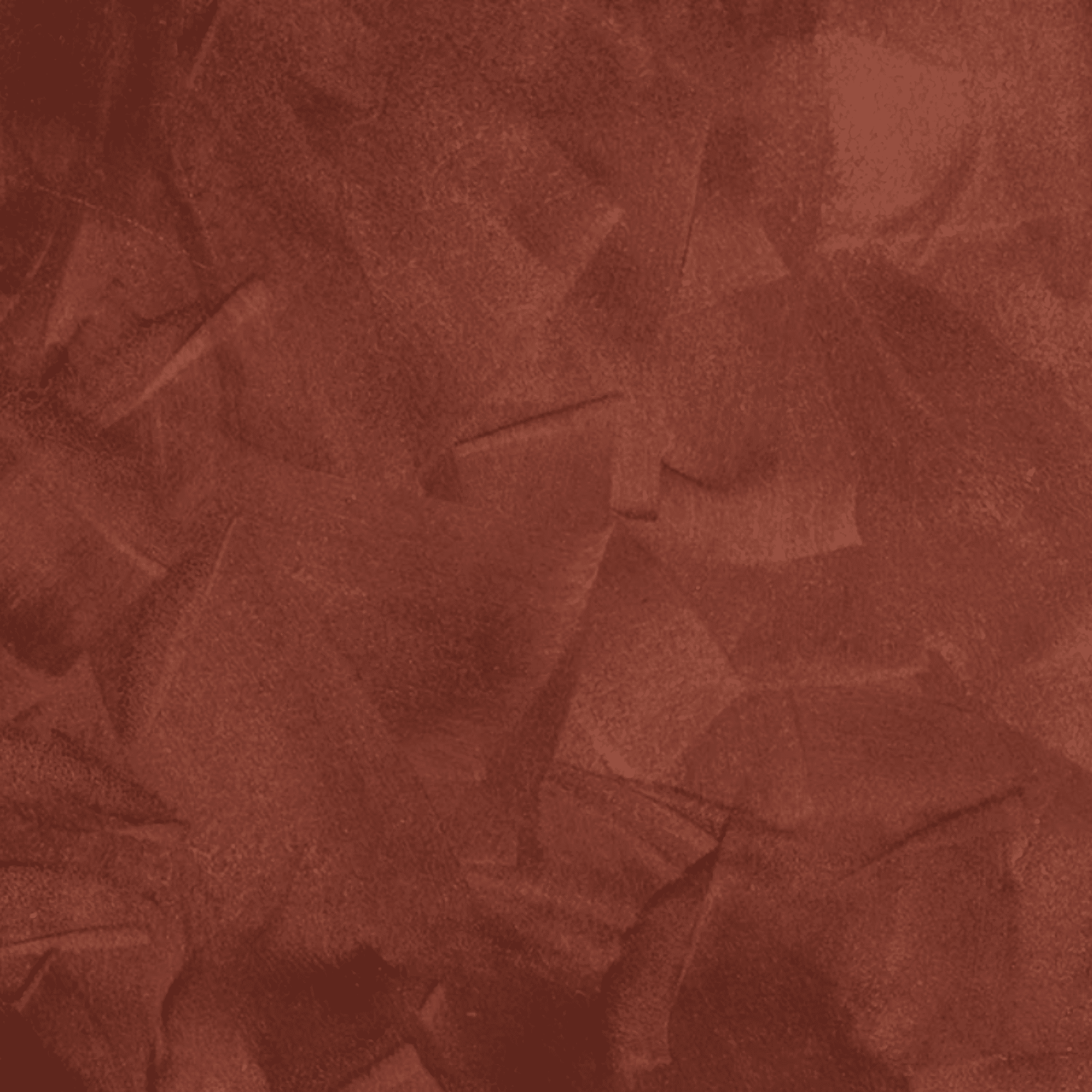 Textured red backdrop featuring a rich, warm hue, ideal for enhancing photography settings and suitable for various photo shoot themes.