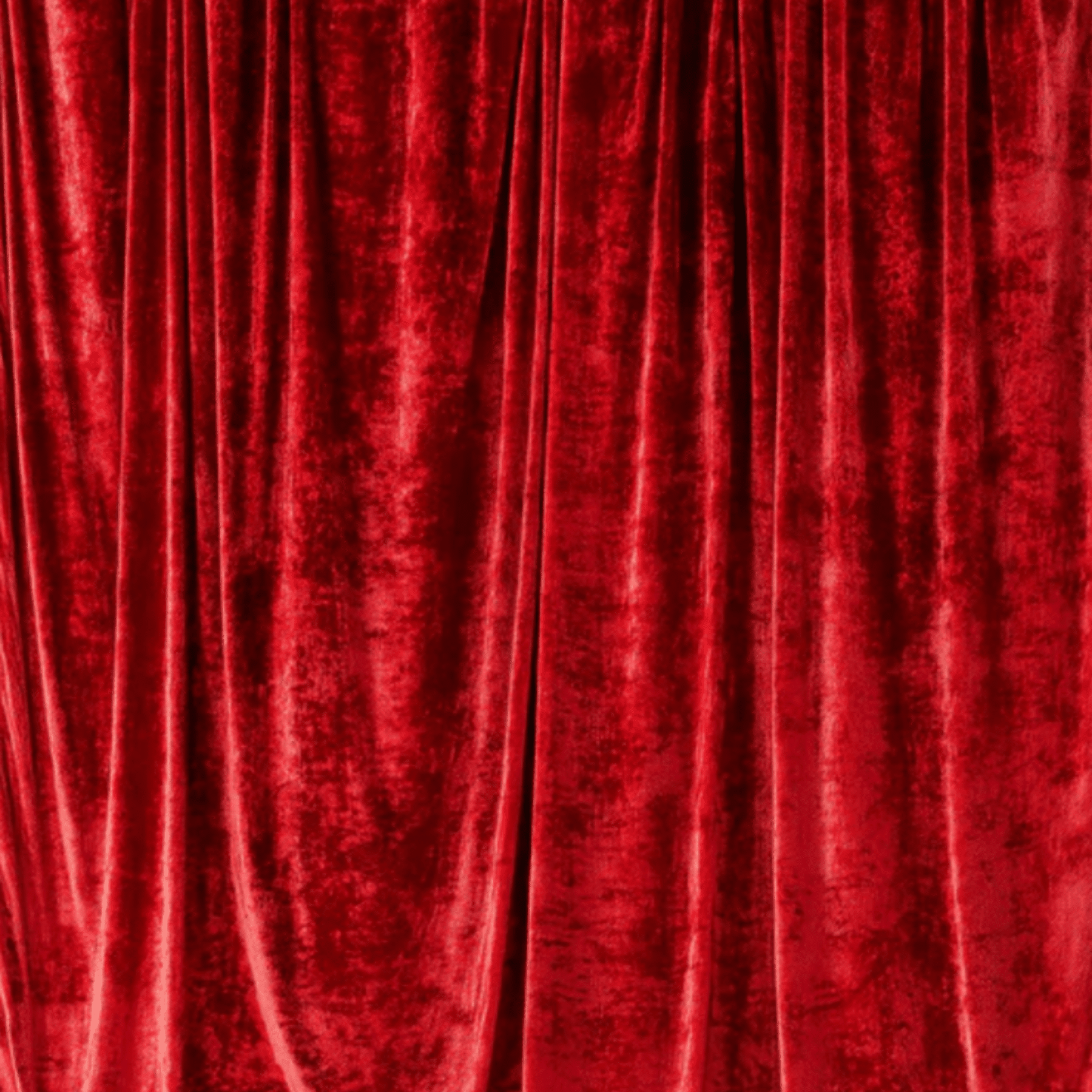 Red velvet backdrop with rich texture and draping folds, ideal for enhancing photography settings.