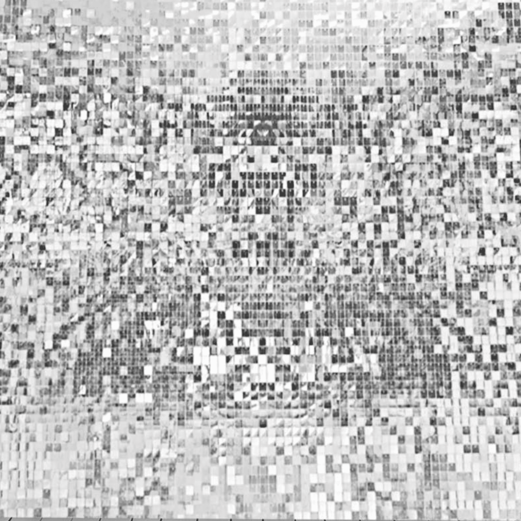 Abstract black and white backdrop with a mosaic pattern of varying shades, ideal for enhancing photographic compositions.