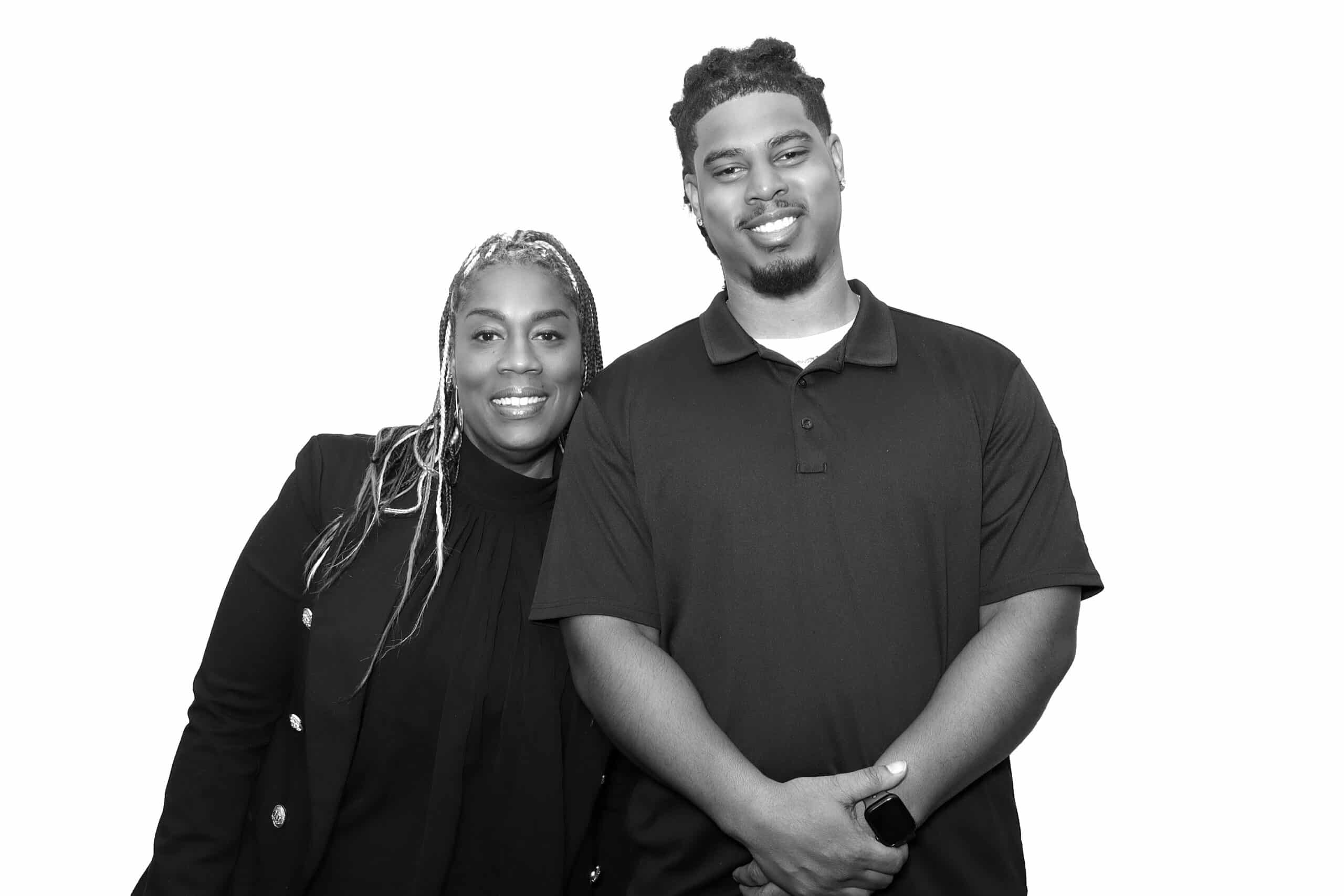 2 people pose for the photo booth with glam filter.