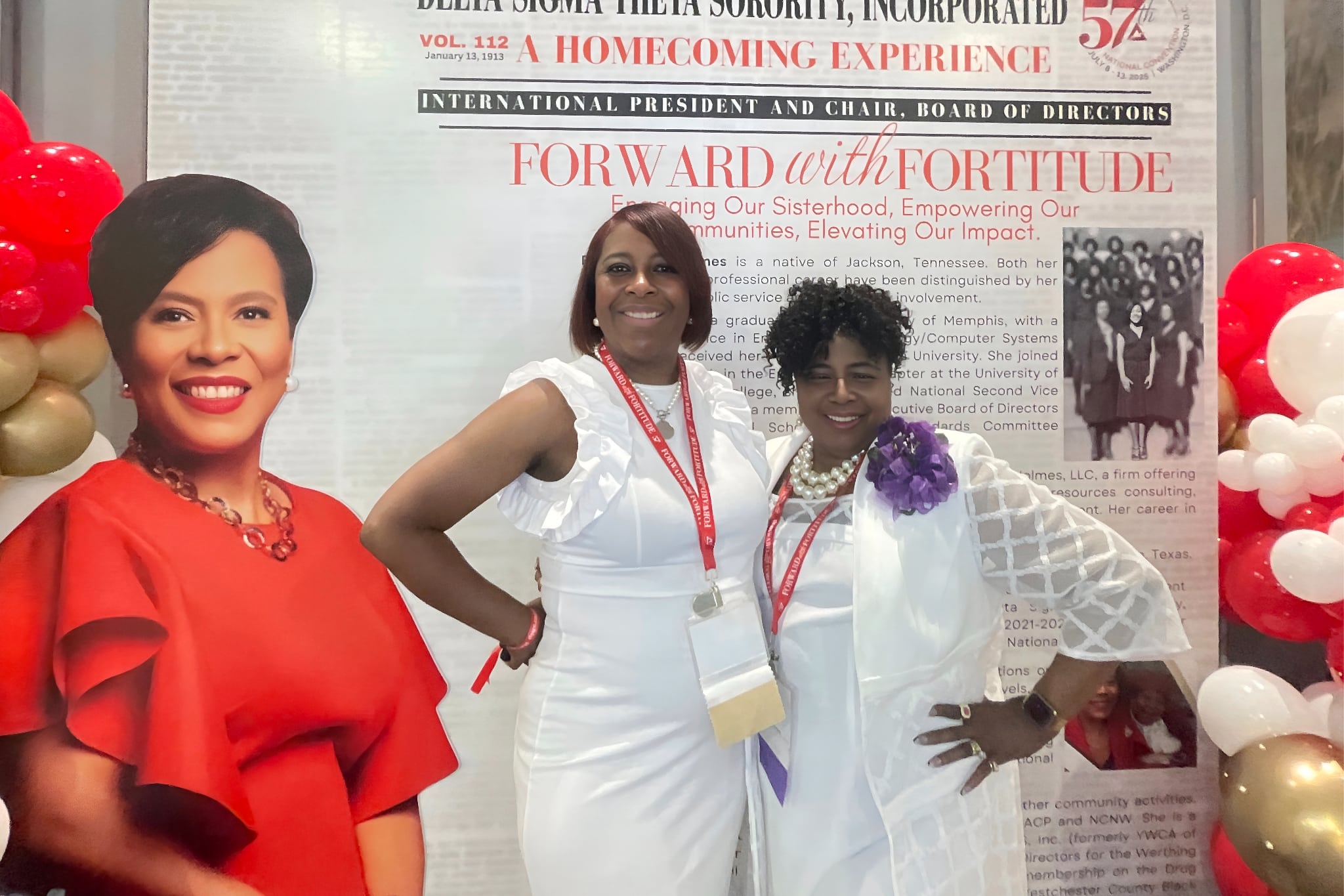 women at a conference posing for photo booth