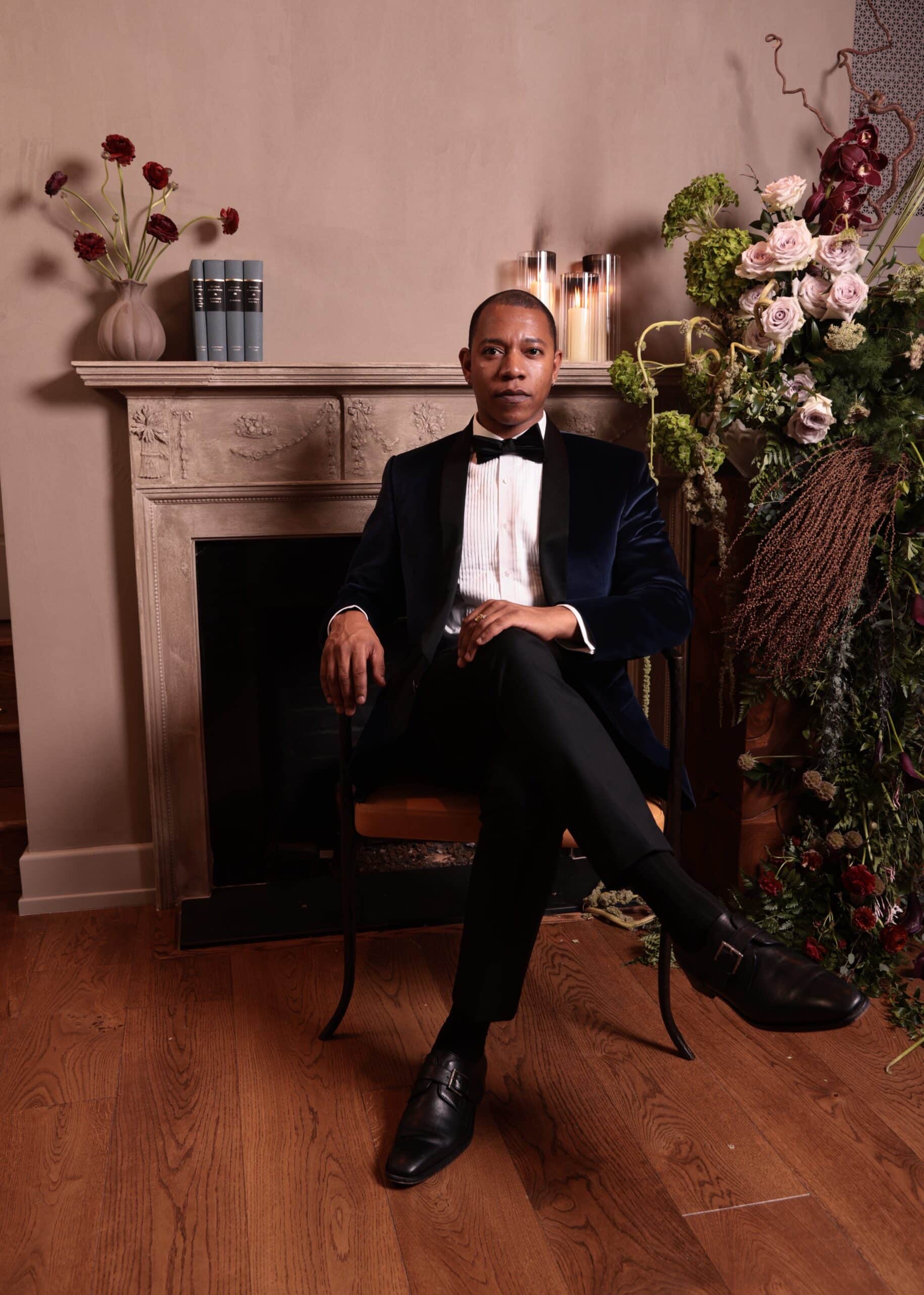 A gentleman sits in a chair posing for the photo booth photo studio in washington, DC.