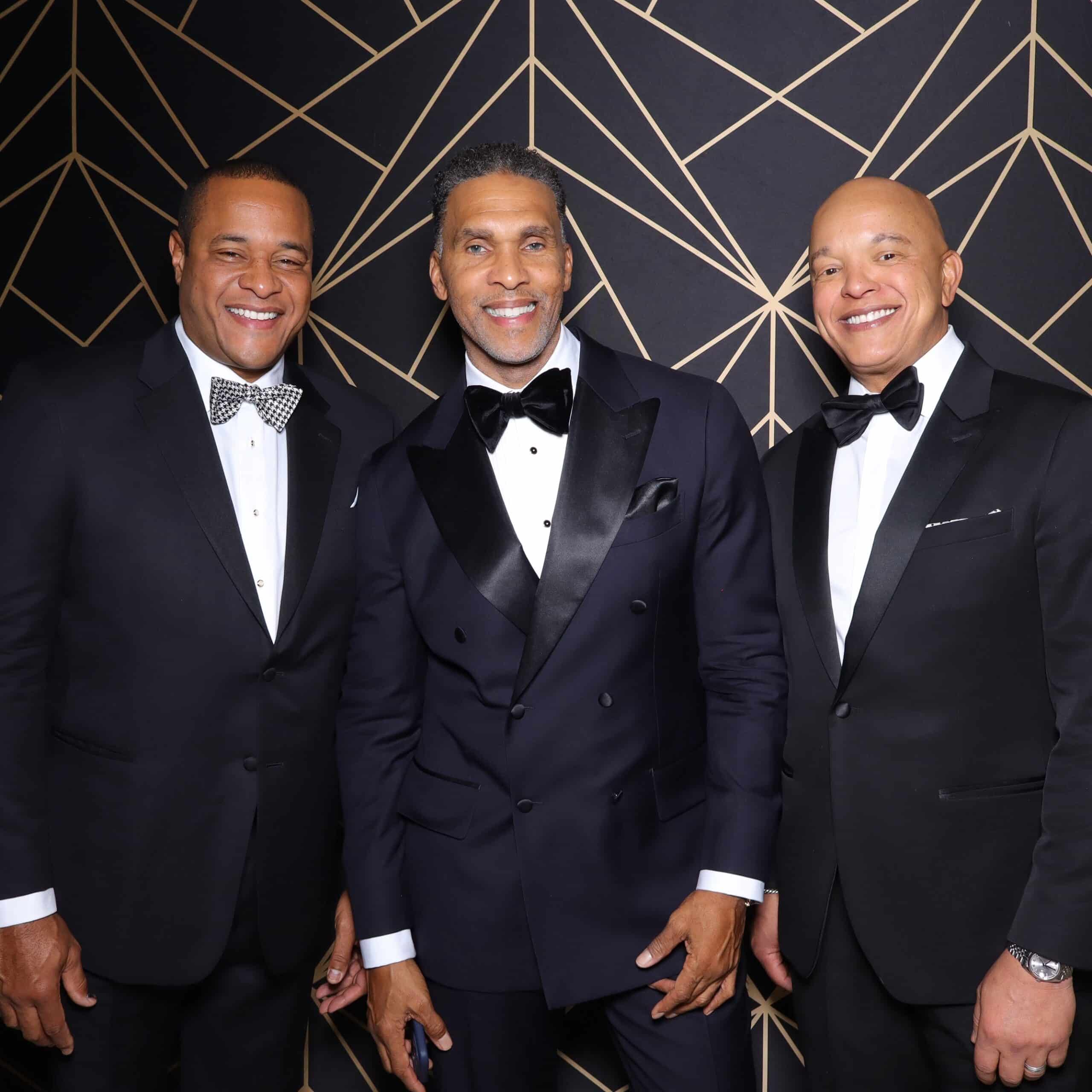 Men pose at a washington dc gala for the phototique photo booths