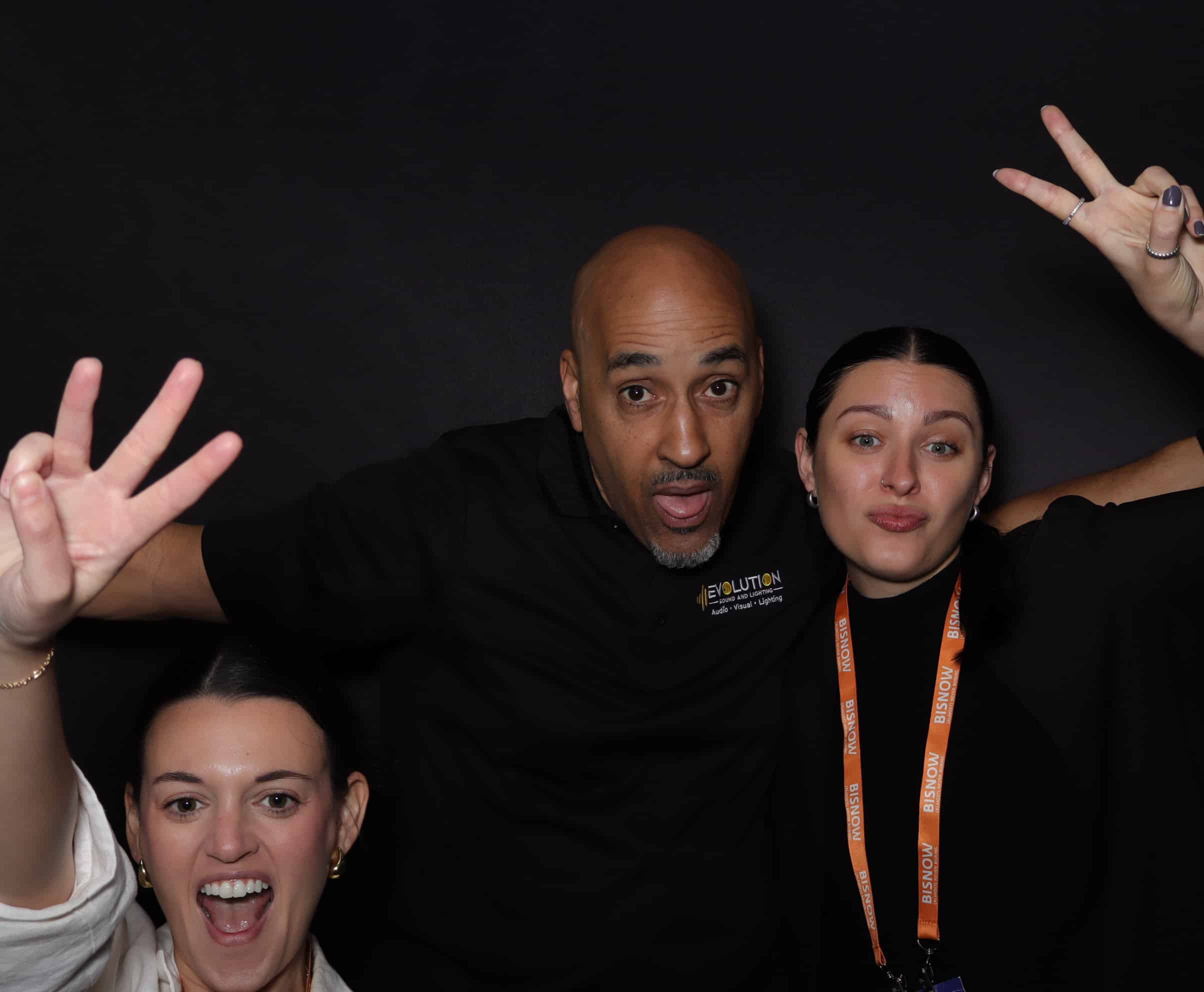 group of people take photos in the photo booth for washington dc conference