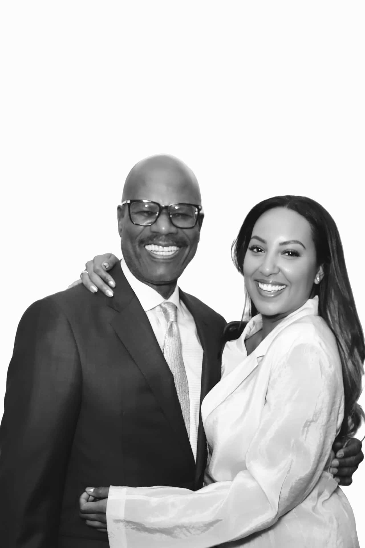 A couple pose with one's hand around the neck of the other for a photo booth in washington, DC