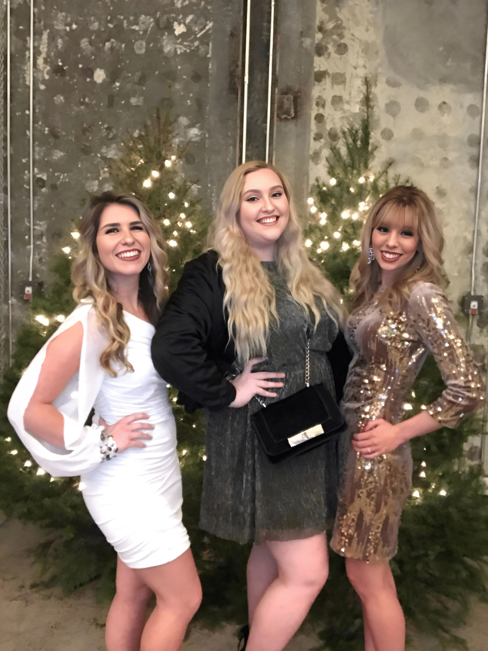 Friends pose for photo booth at corporate holiday party in DC