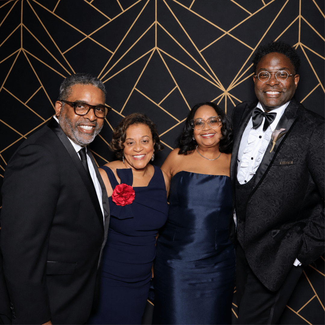 Friends pose at a corporate holiday party in dc