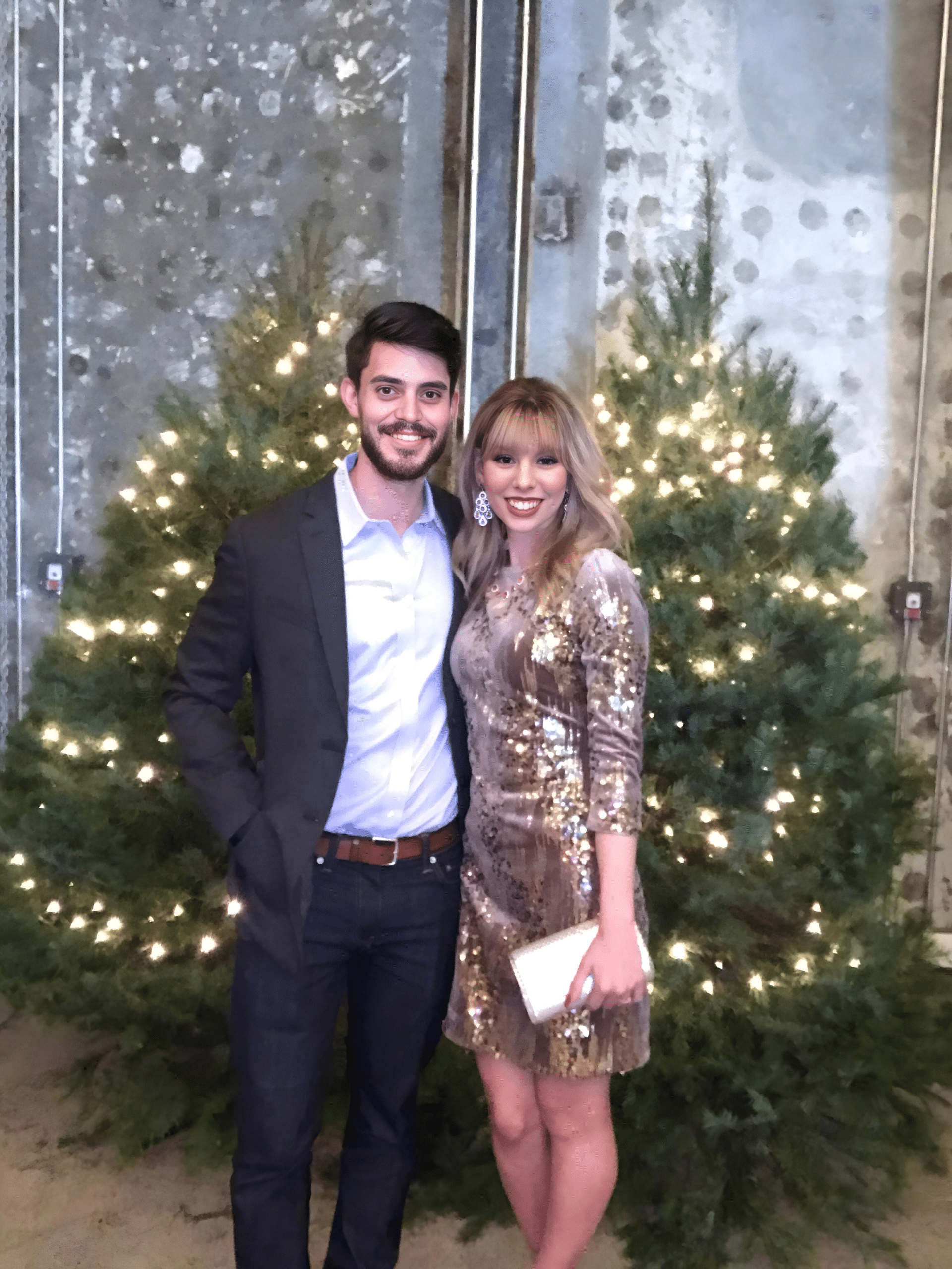 couple poses for photo booth at a DC corporate holiday party